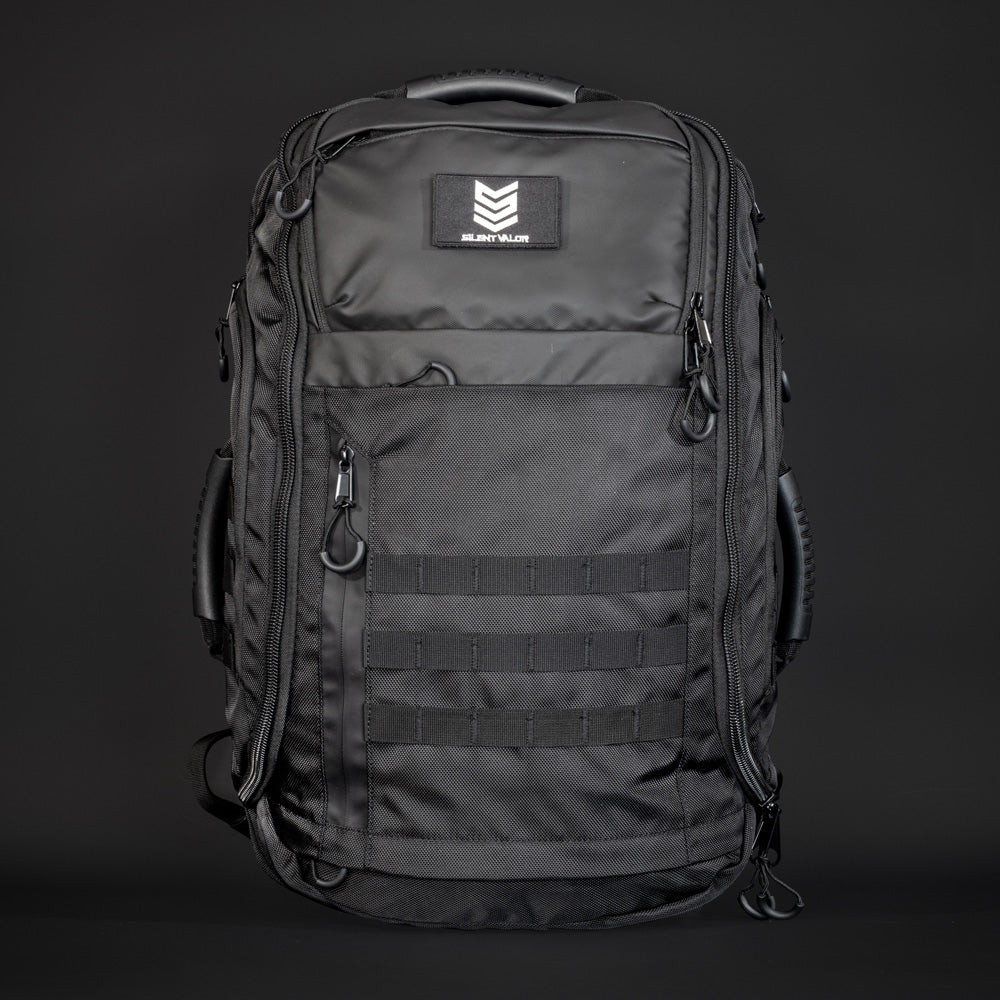 Black tactical backpack with a visible brand logo on a dark background