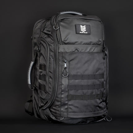 Black tactical backpack with visible brand logo on a dark background